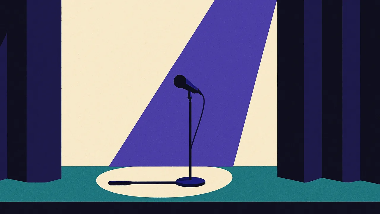 an empty conference stage with a single standing microphone under a spotlight